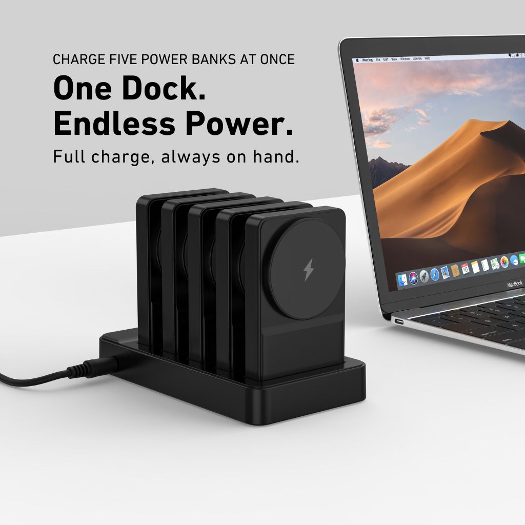 Black multi-device charging dock with laptop on a white background